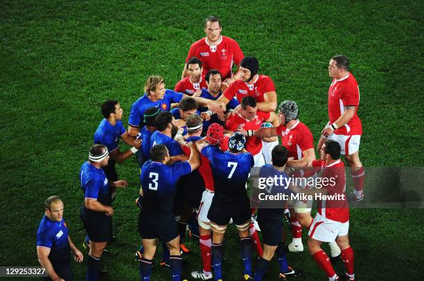 France and Wales players clash after a dangerous tackle on Vincent Clerc of France by Sam Warburton of Wales during semi final one of the 2011 IRB...