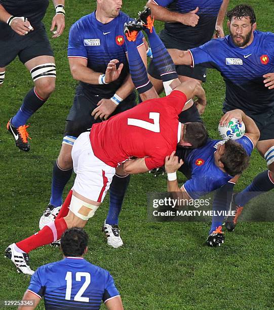 Wales' flanker Sam Warburton tackles dangerously France's right wing Vincent Clerc and gets red carded during the 2011 Rugby World Cup semi-fianl...