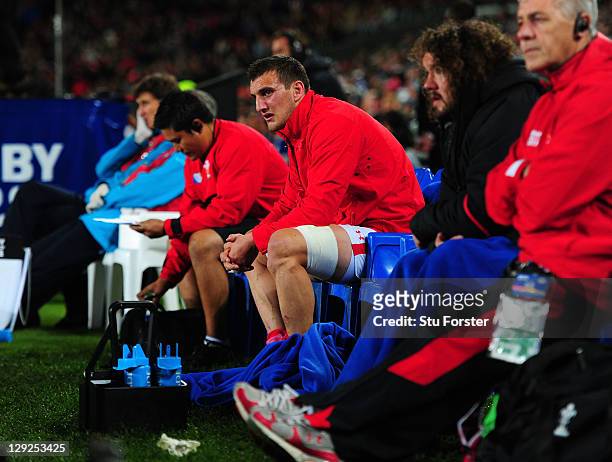 Sent off Wales captain Sam Warburton looks on from the bench during semi final one of the 2011 IRB Rugby World Cup between Wales and France at Eden...