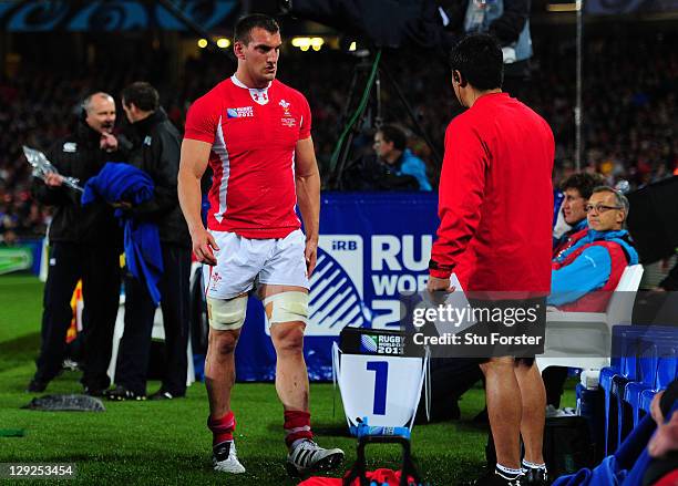 Wales captain Sam Warburton leaves the pitch after receiving a straight red card for a dengerous tackle on Vincent Clerc of France during semi final...