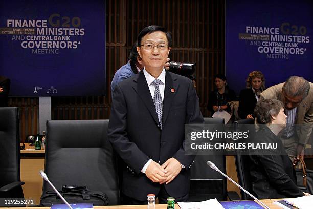 China's Finance Minister Xie Xuren poses on the second day of the G20 meeting of Finance Ministers and Central Bank Governors on October 15 in Paris....