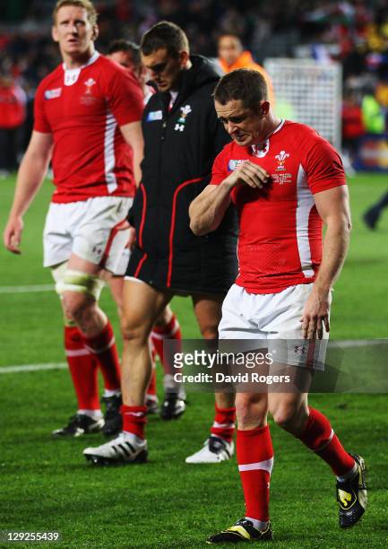 Shane Williams of Wales shows his dejection along with his teammate as they walk a lap of honour after Wales lose 9-8 in semi final one of the 2011...