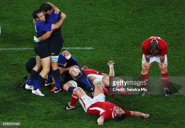 Morgan Parra and Lionel Nallet of France celebrate victory after the semi final one of the 2011 IRB Rugby World Cup between Wales and France at Eden...