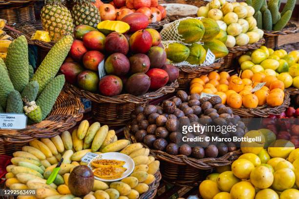 fruit baskets in a local market, madeira - funchal imagens e fotografias de stock