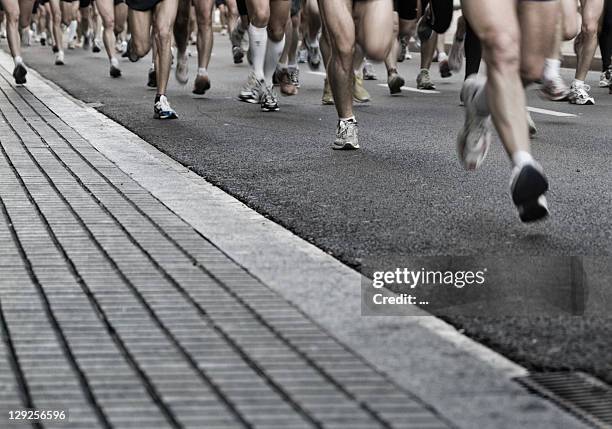 runners - street running stock pictures, royalty-free photos & images