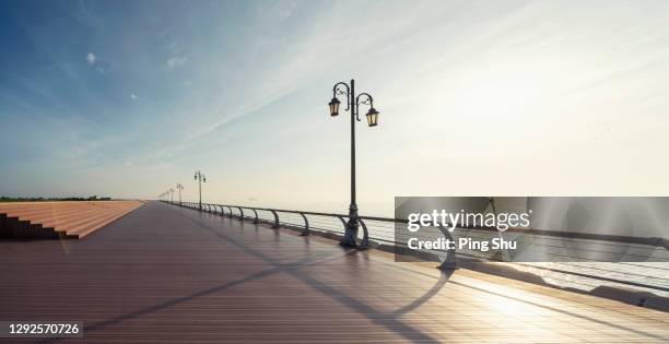 offshore wooden outdoor platform - beach pier stock pictures, royalty-free photos & images