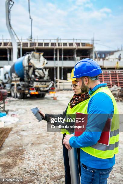 engineers having meeting regarding new construction phase - civil engineering stock pictures, royalty-free photos & images