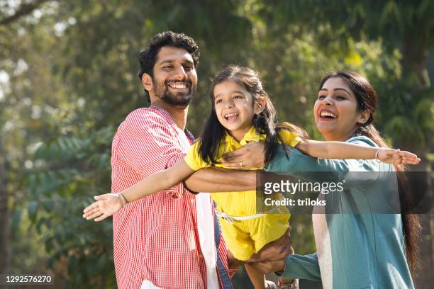 family having fun at park - india stock pictures, royalty-free photos & images