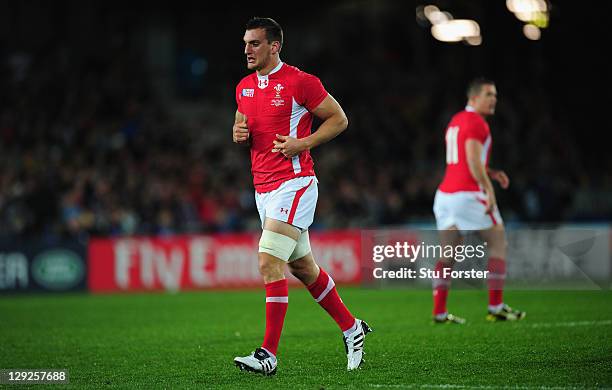 Wales captain Sam Warburton leaves the pitch after receiving a straight red card for a dengerous tackle on Vincent Clerc of France during semi final...