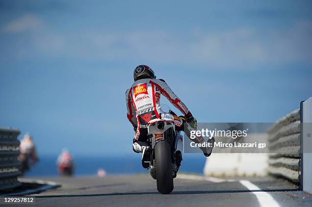 Marco Simoncelli of Italy and San Carlo Honda Gresini starts from the pit during the qualifying practice for the Australian MotoGP, which is round 16...