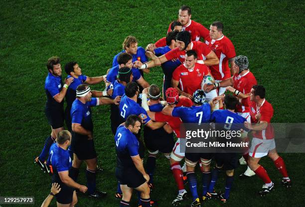 France and Wales players clash after a dangerous tackle on Vincent Clerc of France by Sam Warburton of Wales during semi final one of the 2011 IRB...