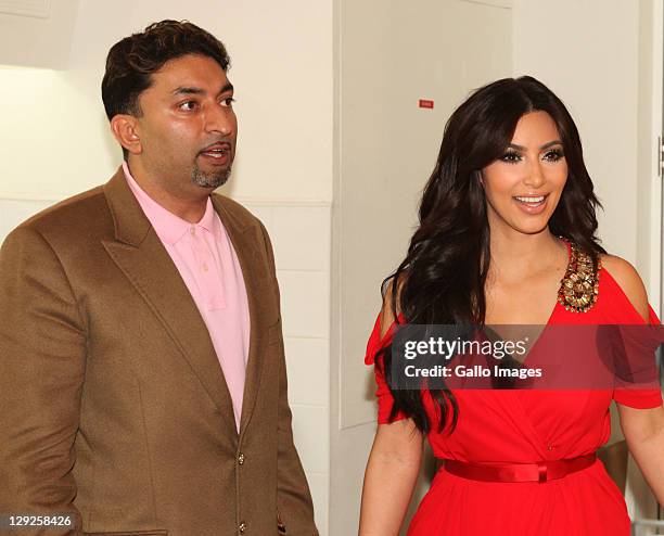 Sheeraz Hasan and Kim Kardashian attend the opening of the new Millions of Milkshakes store at Dubai Mall on October 14, 2011 in Dubai, United Arab...