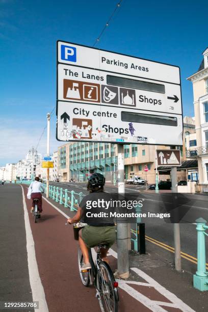 bicycle lane on brighton seafront in east sussex, england - town sign stock pictures, royalty-free photos & images