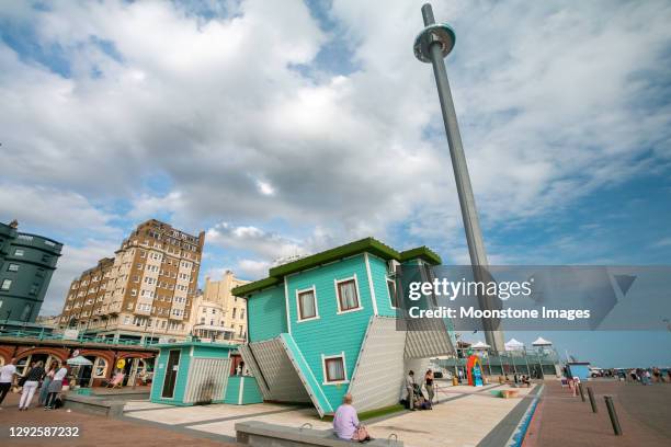 upside down house on kings road arches in brighton, england - upside down house illusion stock pictures, royalty-free photos & images