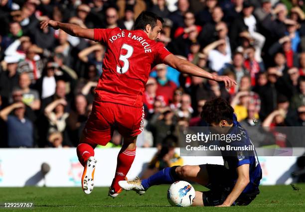 Jose Enrique of Liverpool competes with Ji-Sung Park of Manchester United during the Barclays Premier League match between Liverpool and Manchester...