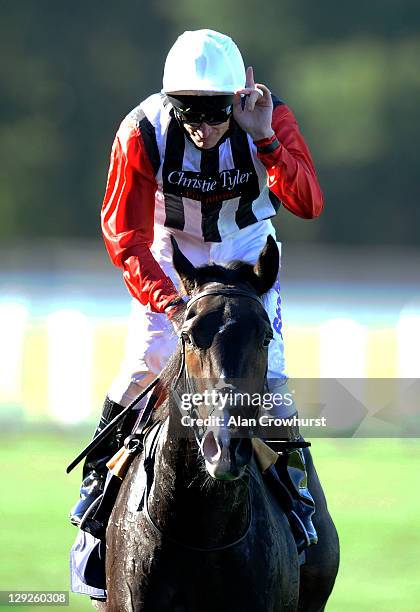 Johny Murtagh riding Deacon Blues celebrates winning the Qipco British Champions Sprint Stakes at Ascot racecourse on October 15, 2011 in Ascot,...