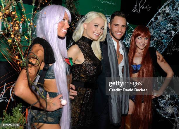 Television personality Holly Madison and Josh Strickland arrive at the Chateau Gardens at Paris Las Vegas on October 14, 2011 in Las Vegas, Nevada.