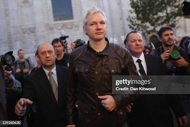 Julian Assange, the founder of the WikiLeaks website arrives to speak to protesters outside St Paul's Cathedral during the 'Occupy London' protest on...