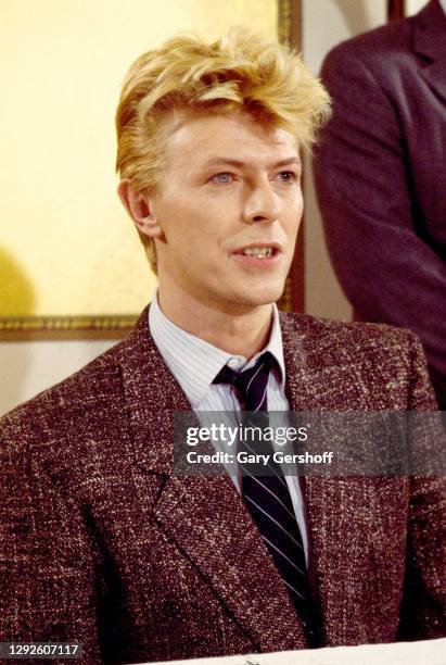 View of British Rock musician and actor David Bowie at the Carlyle Hotel, New York, New York, January 27, 1983. He was there to sign a recording...