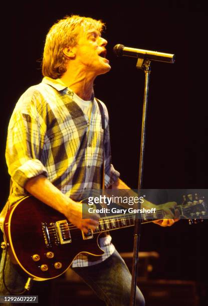 Canadian Rock musician Bryan Adams plays guitar as he performs onstage during the 'Reckless' tour, at Brendan Byrne Arena , East Rutherford, New...