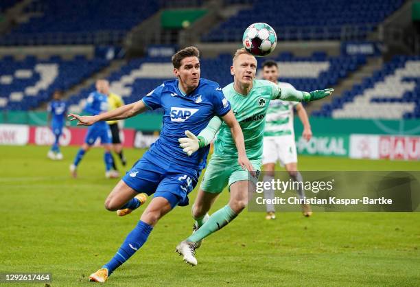 Robert Skov of TSG 1899 Hoffenheim attempts to get round Sascha Burchert of SpVgg Greuther Furth during the DFB Cup second round match between TSG...