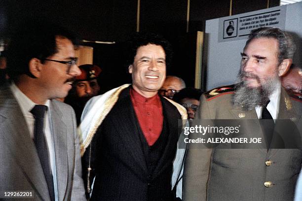 Libyan leader Moamer Kadhafi and Cuban president Fidel Castro walk along with Nicaraguan president Daniel Ortega during the non-aligned countries...