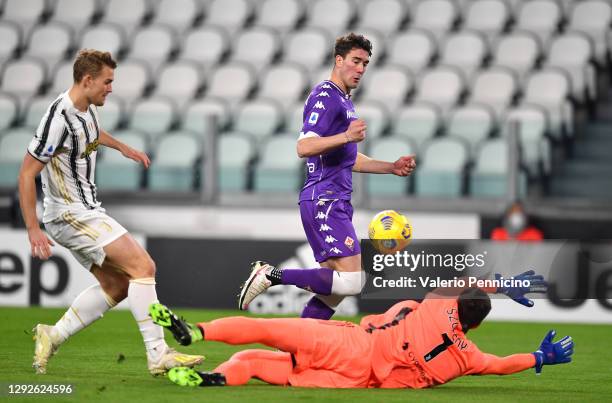 Dusan Vlahovic of Fiorentina scores their sides first goal past Wojciech Szczesny of Juventus during the Serie A match between Juventus and ACF...