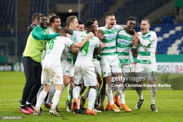 Hans Nunoo Sarpei, Paul Seguin, Hans Nunoo Sarpei and David Raum of SpVgg Greuther Furth celebrate victory in the penalty shootout with teammates...