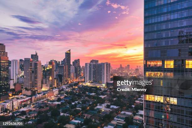 manila colorful sunset makati skyscrapers metro manila philippines - national capital region philippines stock pictures, royalty-free photos & images