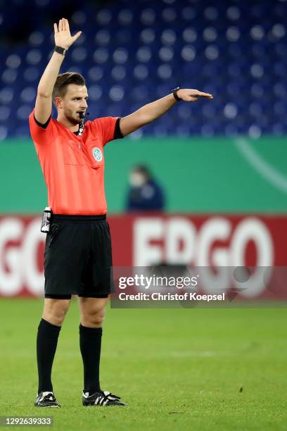 Referee Daniel Schlager reacts during the DFB Cup second round match between SSV Ulm 1846 Fußball and FC Schalke 04 at Veltins Arena on December 22,...