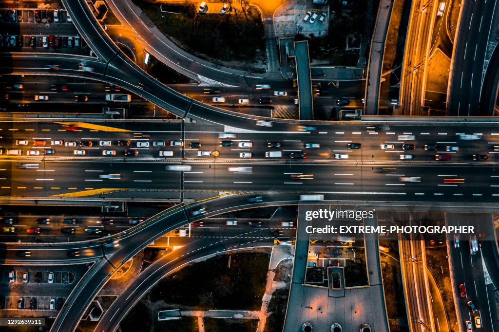 Multiple lane road intersection seen at night directly from above