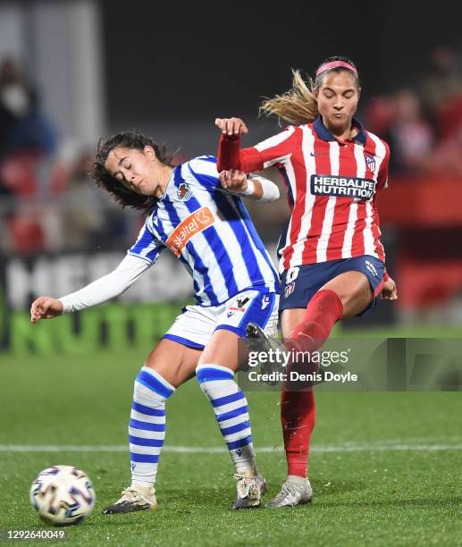 Deyna Castellanos of Atletico de Madrid shoots past Nuria Rabano of Real Sociedad to score her team's 2nd goal during the Primera Iberdrola match...