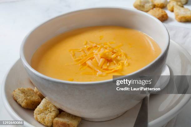 creamy cheddar cheese soup with croutons - cheese sauce stock pictures, royalty-free photos & images