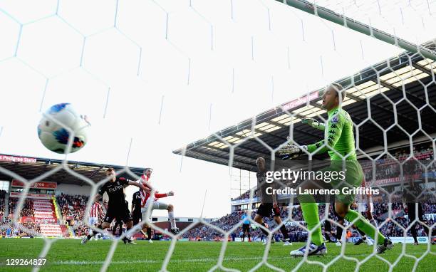 Rory Delap of Stoke City scores the second goal past Mark Schwarzer of Fulham during the Barclays Premier League match between Stoke City and Fulham...