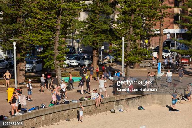 People are seen exercising at Manly Beach on December 23, 2020 in Sydney, Australia. Sydney's northern beaches is on lockdown, as a cluster of...