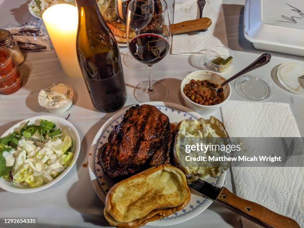 a steak dinner setup in a parking lot for take out dining. - san luis obispo stock pictures, royalty-free photos & images