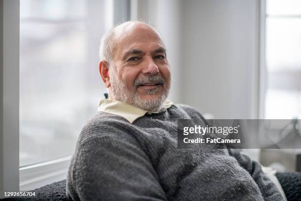 portrait or senior man at home - mature men stock pictures, royalty-free photos & images
