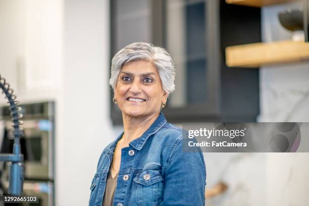 beautiful senior woman with grey hair - indian woman short hair stock pictures, royalty-free photos & images