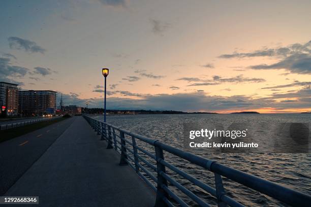 sunset at rimouski promenade, quebec - quebec road stock pictures, royalty-free photos & images