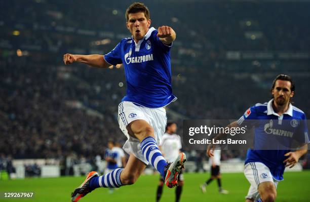 Klaas Jan Huntelaar of Schalke celebrates after scoring his teams first goal during the Bundesliga match between FC Schalke 04 and 1. FC...