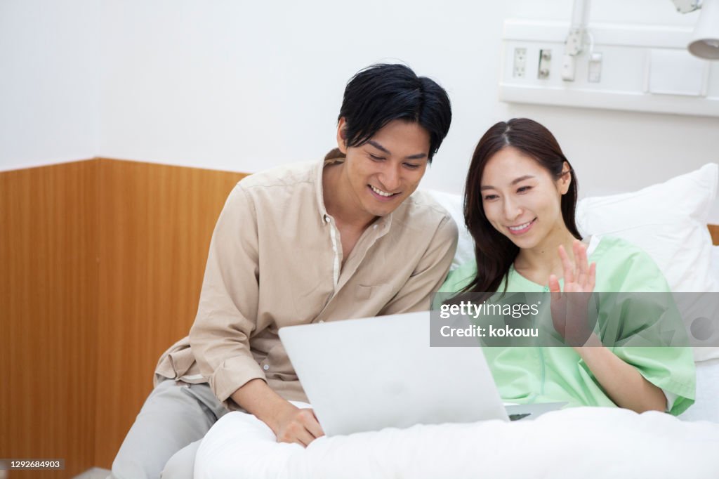 My wife and husband in the hospital are making a video call to a friend