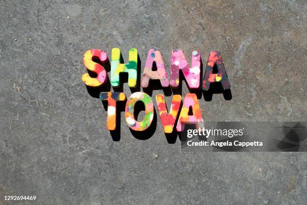 crayon letters spelling out shana tova - rosh hashanah stock pictures, royalty-free photos & images