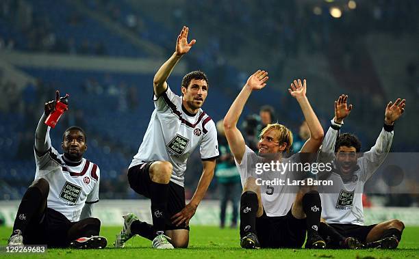 Richard Sukuta-Pasu, Mathias Abel, Martin Amedick and Olcay Sahan of Kaiserslautern celebrate after winning the Bundesliga match between FC Schalke...