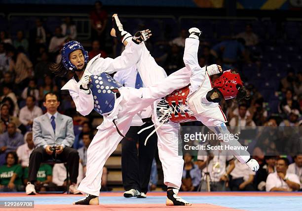 Deireanne Estephany Morales of USA in action with Elizabeth Zamora of Guatemala during the Women's Taekwondo under 49KG category during Day One of...