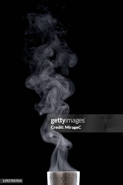 steam of hot drink on top of cup - steam black background stock pictures, royalty-free photos & images