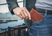Men's hand wallet in the pocket