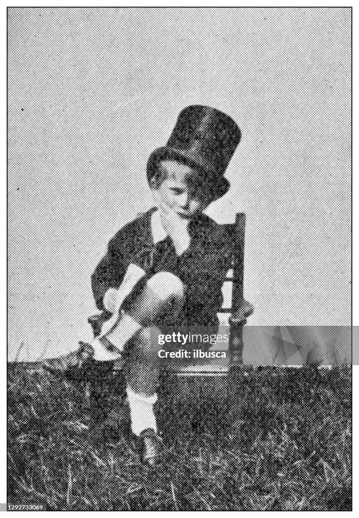 Antique dotprinted black and white photograph: Child businessman