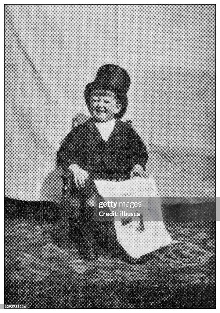 Antique dotprinted black and white photograph: Child businessman