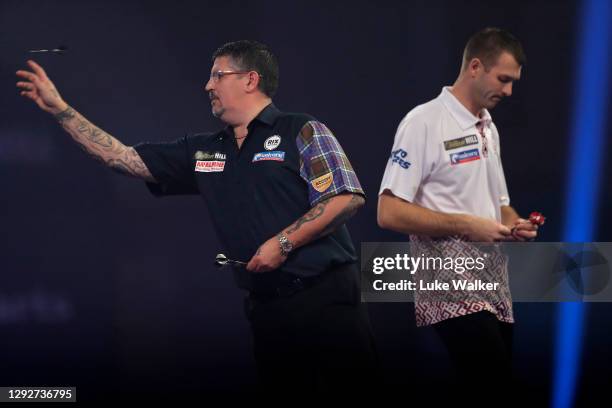 Gary Anderson of England in action during his second round match against Madars Razma of Latvia during day nine of the PDC William Hill World Darts...