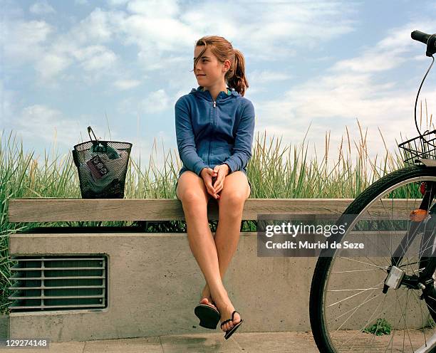 girl sitting on bench - beach denmark stock pictures, royalty-free photos & images